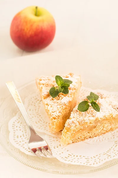 Two pieces of freshly baked apple crumble-topping