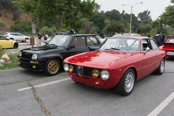 Vintage Alfa Romeo GTV and Renault 5 Turbo Gr4 Bozian on display