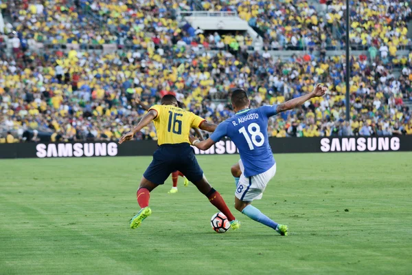 Antonio Valencia 16 and Renato Augusto 18 fighting for the ball