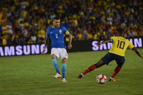 Soccer players Daniel Alves 2 and Walter Ayovi during Copa Ameri