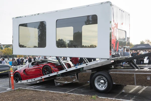 Bugatti Veyron entering enclosed auto transport
