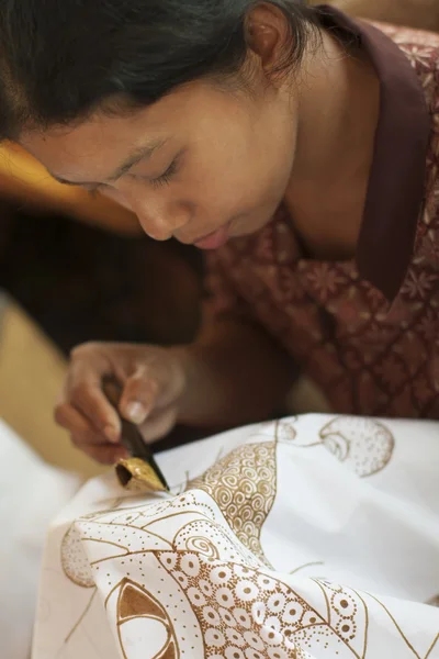 Woman makes Batik