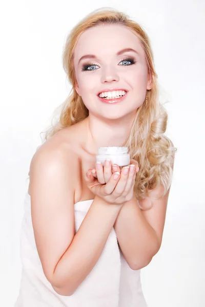 Beautiful spa girl, Cute blonde holding a jar of cream. The purs