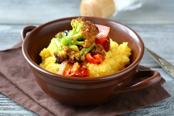 Polenta with roasted peppers, tomatoes and broccoli