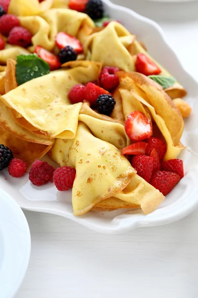 Hot crepes with berry mix