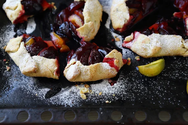 Rustic plums galette with sugar powder