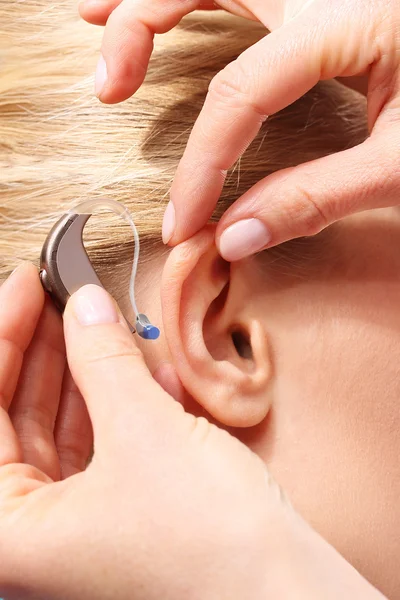 Inserting your hearing instruments.