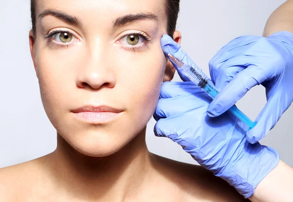 Filling of wrinkles, crow's feet, injection of botox