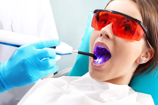 Light-curing seals, the woman at the dentist