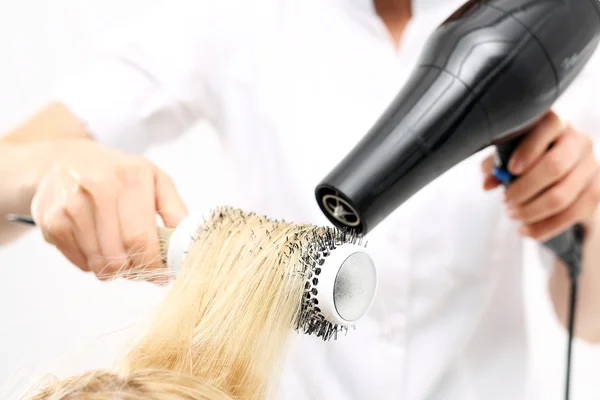 Medium-length hair, hairdresser models hair brush