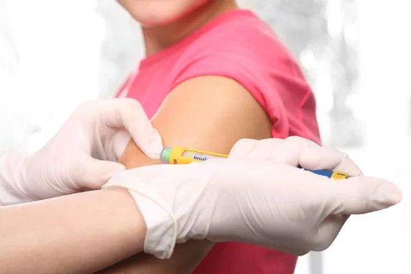 The injection of insulin, a child with diabetes