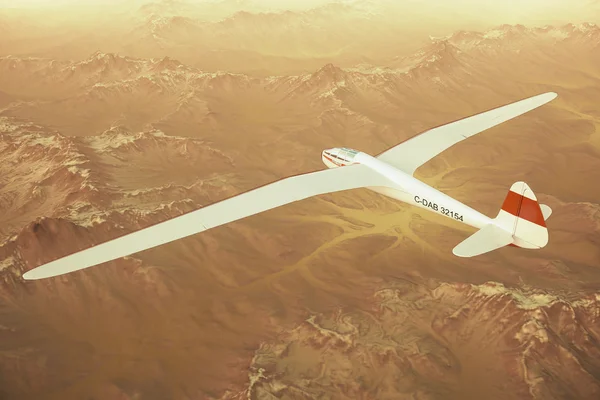 Sailplane over snow capped mountains.