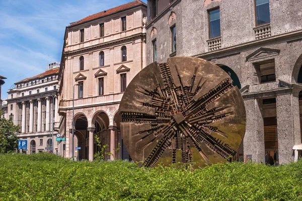 Milan, Italy - May 25, 2016: Disco, abstract bronze circular sculpture with contemporary value. Piazza Fillippo Meda