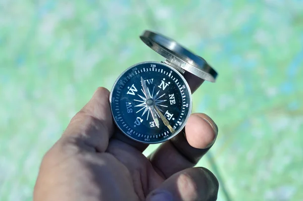 Compass in hand.