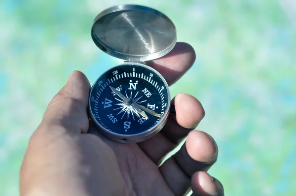 Compass in hand.