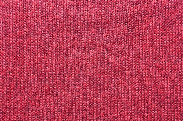 Purple red pink knitted sweater texture background. Space for copy, text, lettering.