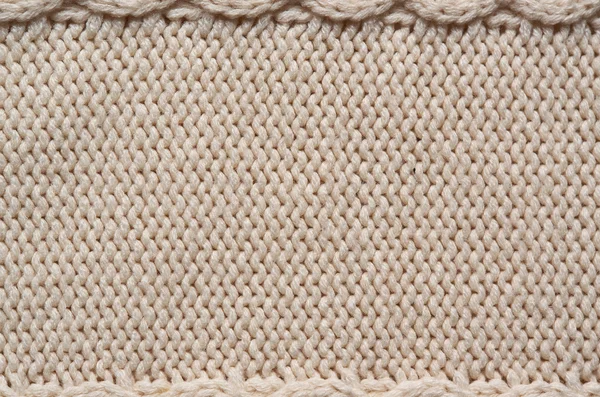 Beige white knitted sweater texture background. Space for copy, text, lettering.