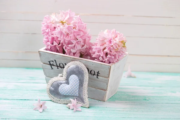 Pink hyacinths flowers in wooden box