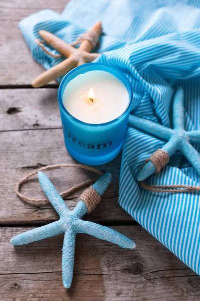 Blue candle and marine items