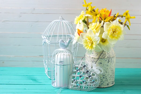 Background with fresh daffodils  and decorative heart