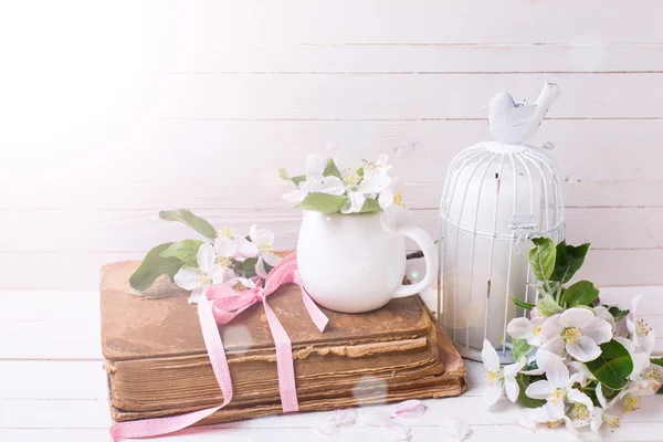 Apple blossoms,  old book, candle