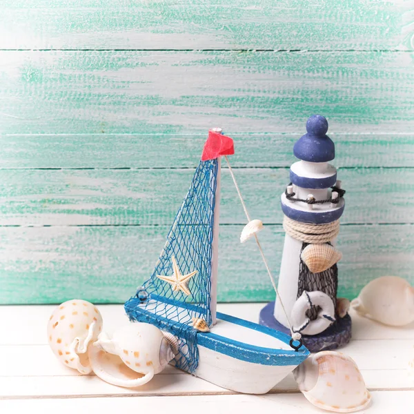 Lighthouse, sailing boat and marine items