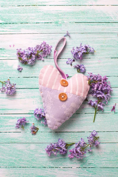 Decorative heart and lilac flowers
