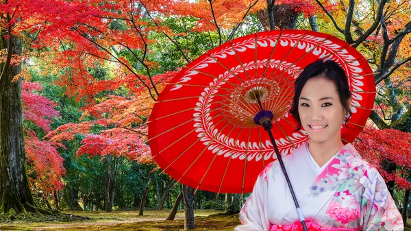 Young Japanese Woman in A Japanese Garden in Autumn