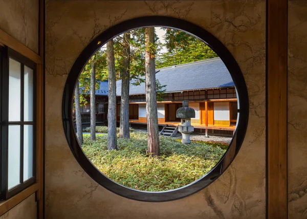 View of a Japan Garden Through a Round Window