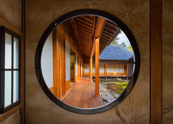 View of a Japanese Garden Through a Round Window