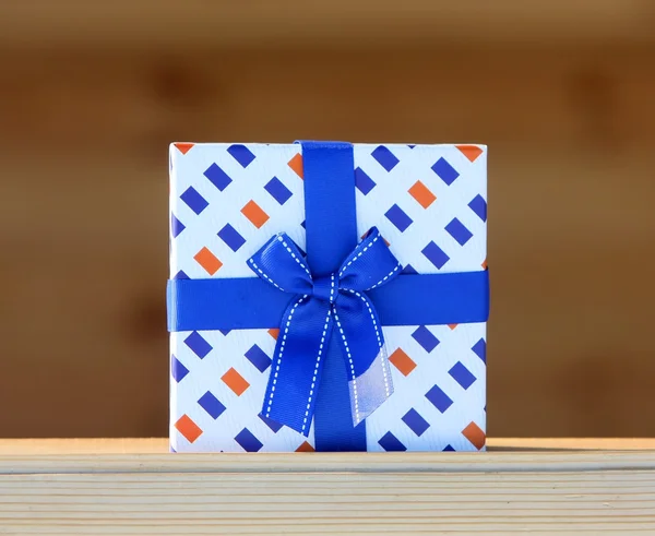 Gift box with a blue bow.