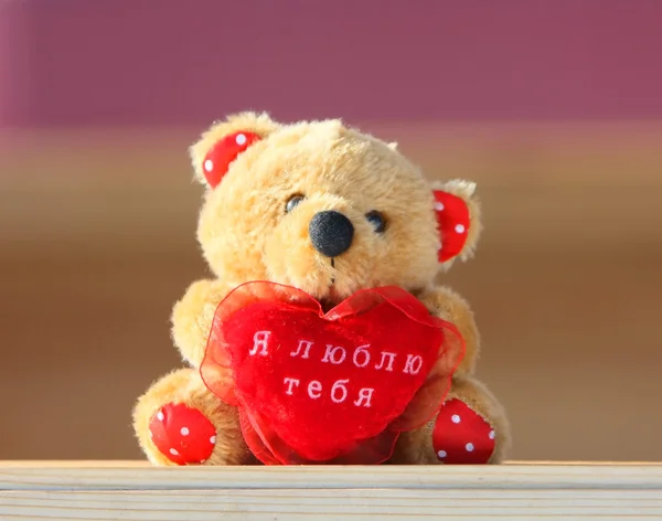 Teddy bear and red heart.