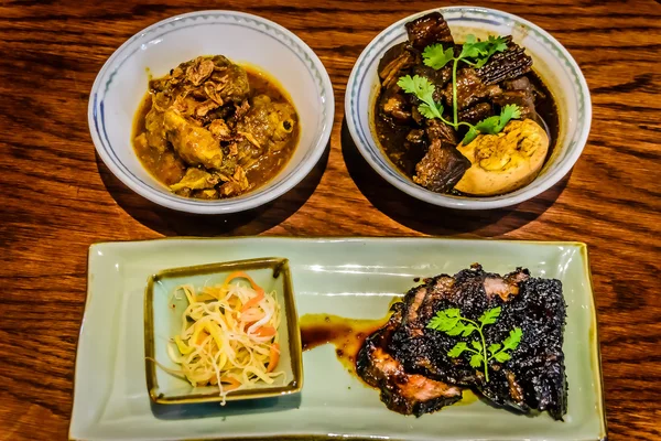 Peranakan dishes Sakura chicken braised in authentic Penang Nyonya curry gravy Pork belly braised with dark soya sauce Pan-grilled Wagyu beef sirloin glazed in Indonesian sweet sauce