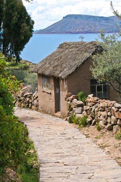 Stone path and little mud house in Peru
