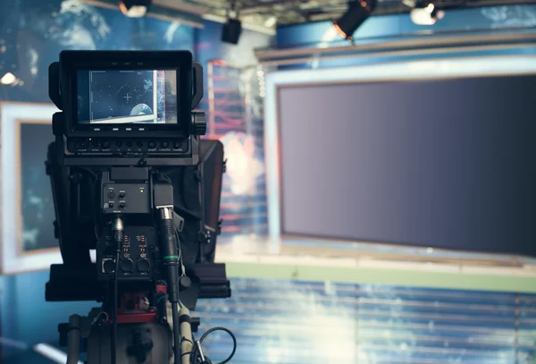 Television studio with camera and lights - recording TV NEWS