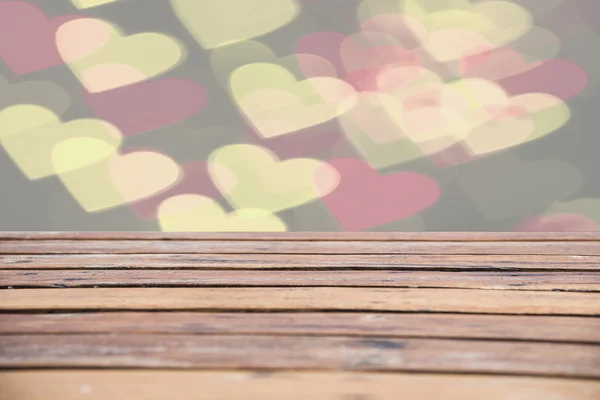 Heart-shaped bokeh blur Christmas table with wooden balconies