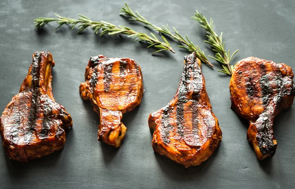 Grilled pork ribs on the wooden background