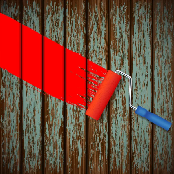 Paint roller and an old wooden fence