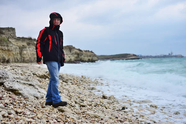 The young man on the beach in the ancient Greek city of Chersonesos in Sevastopol