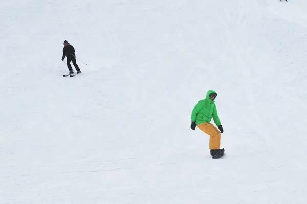 Snowboarders and skiers at a ski resort in Moscow