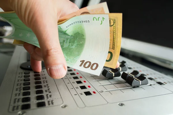 DJ hand with currency