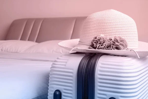 Hat on luggage in the bedroom