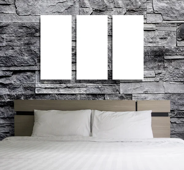 Blank frame on stone wall in the bedroom