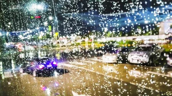 Blur background of light city on a rainy night