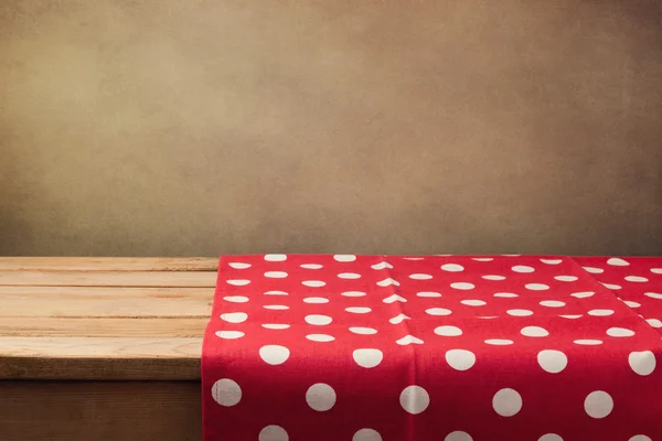 Wooden table with polka dots tablecloth