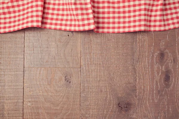 Red checked tablecloth and wooden board