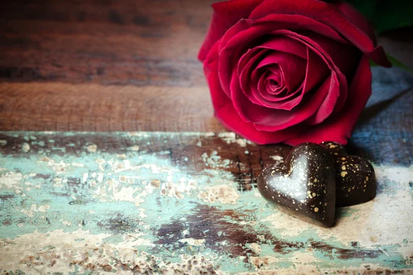 Chocolate candies and rose flower