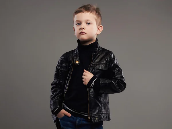 Fashionable child in leather coat.stylish little boy.6 years old kid