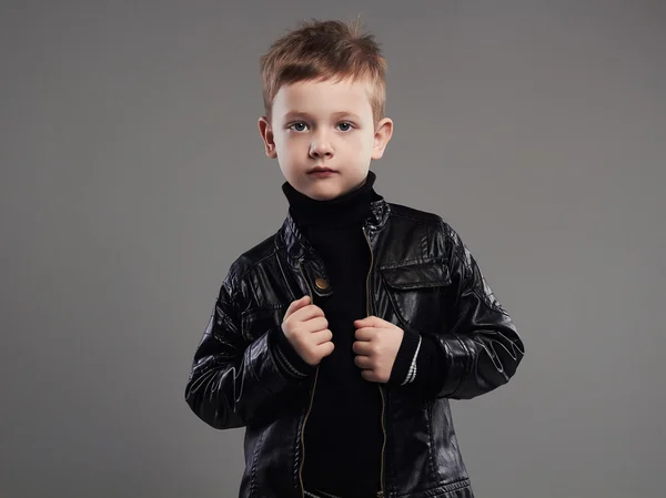 Fashionable child in leather coat.stylish little boy. spring fashion.funny 6 years old kid