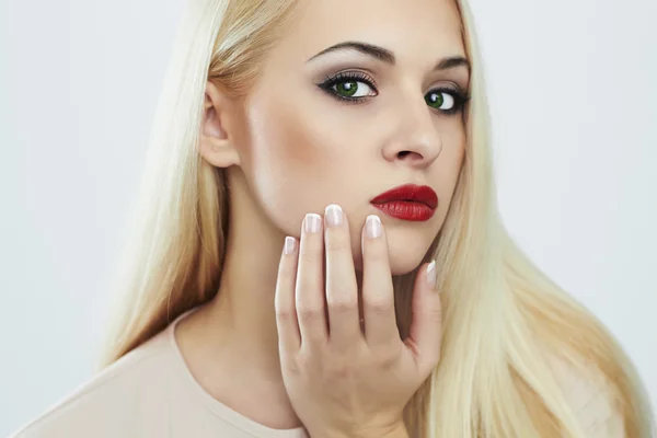 Young Blond woman with manicure.Beautiful model with make-up